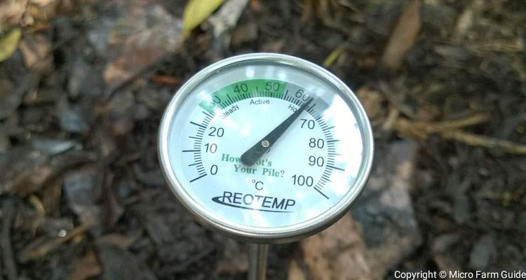 compost thermometer in hot compost pile